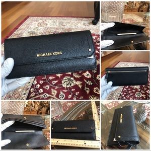 Authentic Michael Kors flap wallet in black